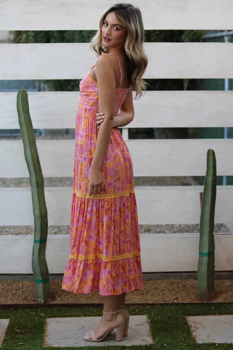 V-neck twist maxi dress with a lace tiered skirt and cut out detail