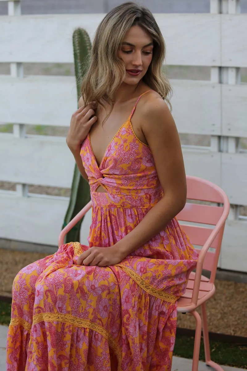 V-neck twist maxi dress with a lace tiered skirt and cut out detail